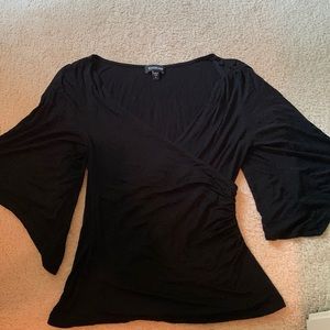 Bebe 3/4 sleeve top. Deep v neck with bell type sleeves. Size small